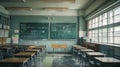 Empty Asian classroom with rows of desks and chairs at a school during quarantine period Royalty Free Stock Photo