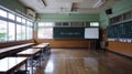 Empty Asian classroom with rows of desks and chairs at a school during quarantine period Royalty Free Stock Photo