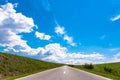 Empty asphalt country road blue sky. Royalty Free Stock Photo