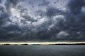 Empty asphalt ground floor with dramatic windstorm clouds sky Royalty Free Stock Photo