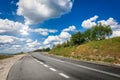 Empty asphalt road and a beautiful blue sky Royalty Free Stock Photo