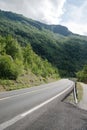 empty asphalt road and beautiful mountains covered with green vegetation Aurlandsfjord Flam