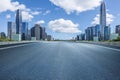 Empty asphalt road and city buildings skyline Royalty Free Stock Photo