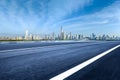 Empty asphalt road and city buildings skyline Royalty Free Stock Photo