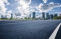 Empty asphalt road and city buildings skyline Royalty Free Stock Photo