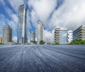 Empty asphalt road and city buildings skyline Royalty Free Stock Photo