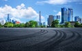 Empty asphalt road and city buildings skyline Royalty Free Stock Photo