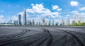 Empty asphalt road and city buildings skyline Royalty Free Stock Photo