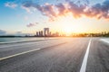 Empty asphalt road and city buildings skyline at sunset in Suzhou Royalty Free Stock Photo