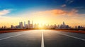 Empty asphalt road with city skyline