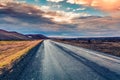 Empty asphalt road with colorful cloudy sky. Royalty Free Stock Photo