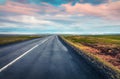 Empty asphalt road with colorful cloudy sky. Royalty Free Stock Photo