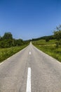 Empty asphalt road in countryside, bend of road, field in the ba Royalty Free Stock Photo