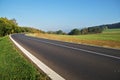 Empty asphalt road in countryside, bend of road Royalty Free Stock Photo