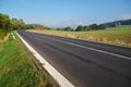 Empty asphalt road in countryside, bend of road Royalty Free Stock Photo