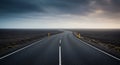 Empty asphalt road cuts through a desolate landscape Royalty Free Stock Photo