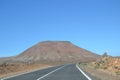 Empty asphalt road on the island of Fuertaventura and The Montana de Tindaya Royalty Free Stock Photo