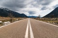 Empty asphalt road in the middle of mountainous area. Highlands of Greece, winter time. Freedom, travel concept. Royalty Free Stock Photo