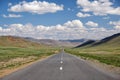Empty asphalt road in Mongolia between mongolian towns Tsagaannuur and Bayan-Olgii