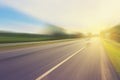 Empty asphalt road in motion blur and sunlight Royalty Free Stock Photo