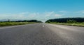 Empty asphalt road and mountain with blue sky scenery background Royalty Free Stock Photo