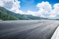 Empty asphalt road and mountain nature scenery Royalty Free Stock Photo