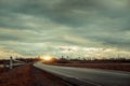 Empty asphalt road with near the lake with cloudy sky in evening light Royalty Free Stock Photo