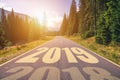 Empty asphalt road and New year 2019 concept. Driving on an empty road in the mountains to upcoming 2019 and leaving behind old 2 Royalty Free Stock Photo