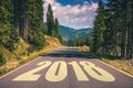 Empty asphalt road and New year 2018 concept. Driving on an empty road in the mountains to upcoming 2018 and leaving behind old 2 Royalty Free Stock Photo