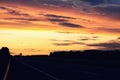 Empty asphalt road and sun rising on skyline. Colorful sunset over road. Minimalist style design. Nature background Royalty Free Stock Photo