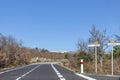 Empty asphalt road to Mont Ventoux, through Provence countryside at sunny winter day in southern France Royalty Free Stock Photo