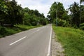 Highway on tropical island. Empty road by jungle Royalty Free Stock Photo