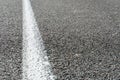 Empty asphalt road. New fresh asphalt pavement away from the city. Development of rural infrastructure. Road marking lines close Royalty Free Stock Photo