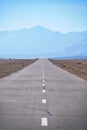 Empty asphalt straight highway road in Mongolia between mongolian towns Khovd and Altai