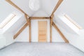 Empty attic room with wooden ceiling beams