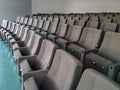 Empty auditorium audience chairs aligned in amphitheater in college university or conference company room for presentations