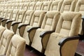 Empty auditorium with beige chairs, theatre or conference hall. Royalty Free Stock Photo
