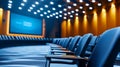 Empty Auditorium with Blue Chairs and Screen with Patterned Floor and Orange Royalty Free Stock Photo