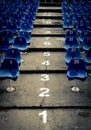 Empty auditorium with blue numbered chairs Royalty Free Stock Photo