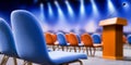 Empty auditorium set for a corporate forum or public speaking event, featuring a podium with microphone and stage lighting Royalty Free Stock Photo