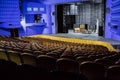 Empty auditorium and stage in the theater. Rehearsal of the play. Artists on stage Royalty Free Stock Photo