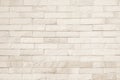 Empty background of wide cream brick wall texture. Beige old brown brick wall concrete or stone textured, wallpaper limestone Royalty Free Stock Photo