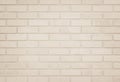 Empty Background of wide cream brick wall texture. Old brown brick wall concrete or stone pattern nature, wallpaper limestone Royalty Free Stock Photo