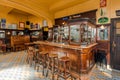 Empty bar, closed space with old counter and vintage wooden furniture