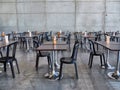 Empty bar terrace with tables raws and chairs respecting distancing rules for pandemics