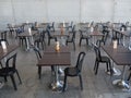 Empty bar terrace with tables raws and chairs respecting distancing rules for pandemics