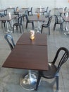 Empty bar terrace with tables raws and chairs respecting distancing rules for pandemics