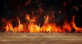 empty barbecue BBQ grill with flaming fire and ember charcoal on black background and wood board table Royalty Free Stock Photo