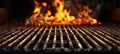 Empty barbecue grill with fiery flames on black background outdoor cooking and grilling concept