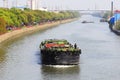 Empty barge on channel in China village